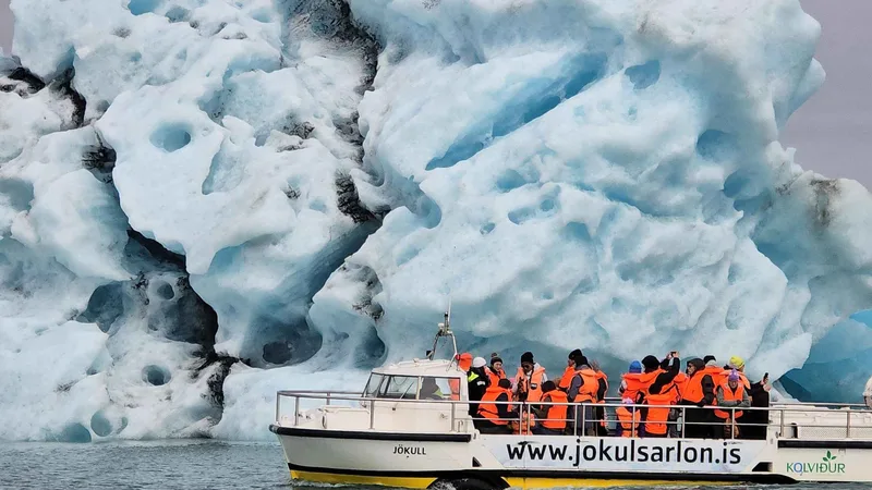 Amphibian boat among floating icebergs on a Jökulsárlón glacier lagoon boat tour in South East Iceland